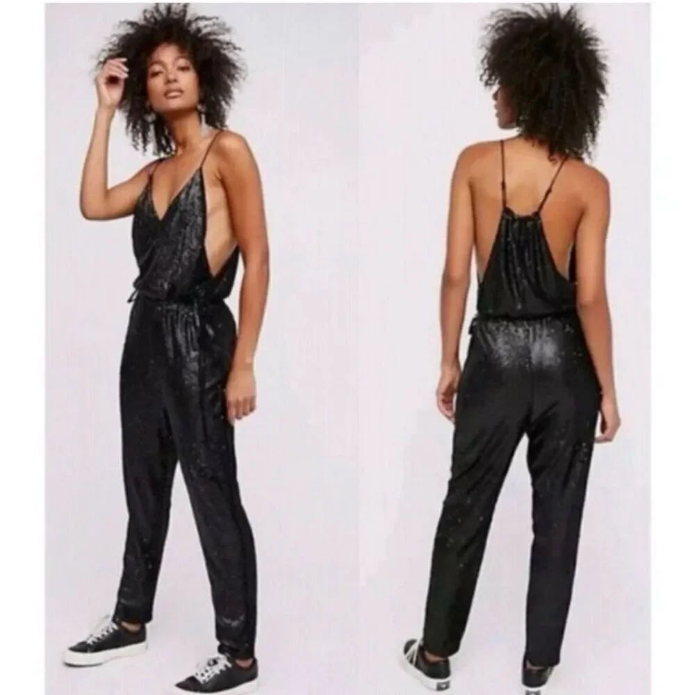 Free People black sequin jumpsuit size Medium adjustable